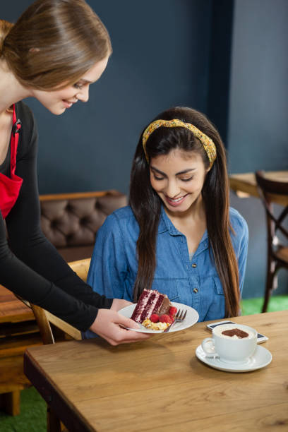 istock Owner serving sweet food to customer 676957078