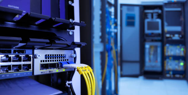 label of fiber optic cable and high speed network router switch in a technology data center room stock photo
