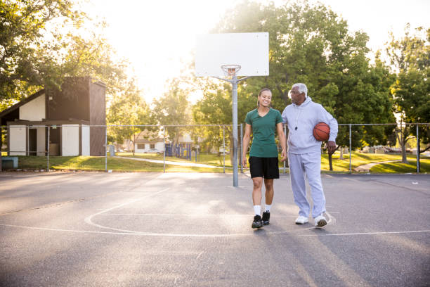 istock Father and Daughter Playing Basketball 677011992
