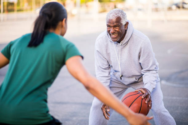 istock Father and Daughter Playing Basketball 677013784