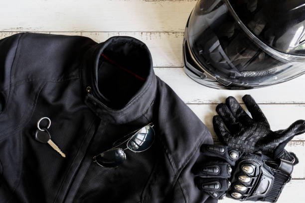 Outfit of Biker and accessories with copy space Outfit of Biker and accessories with copy space, Ready to ride coat garment stock pictures, royalty-free photos & images