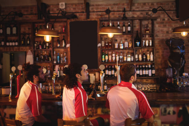 group of male friends watching football match - club soccer fotos imagens e fotografias de stock