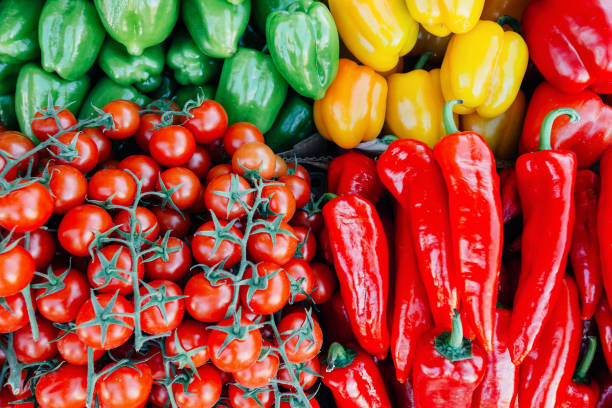 istock Pile of cherry tomatoes and bell peppers 677058456