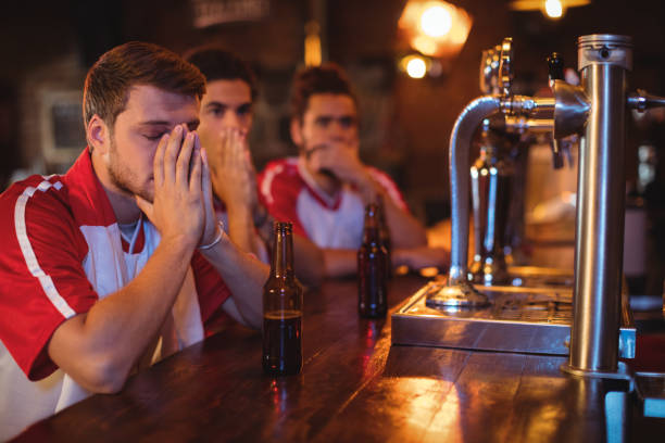 group of male friends watching football match - club soccer fotos imagens e fotografias de stock