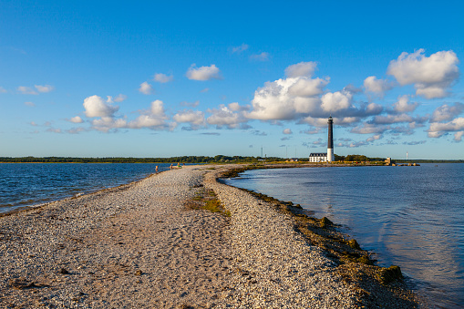 Sorve lighthouse against blue sky, Saaremaa island, Estonia. Long and thin peninsula