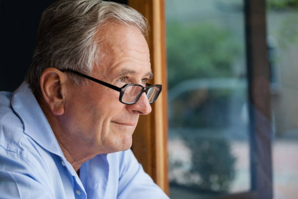 istock Smiling senior man looking away 677077256