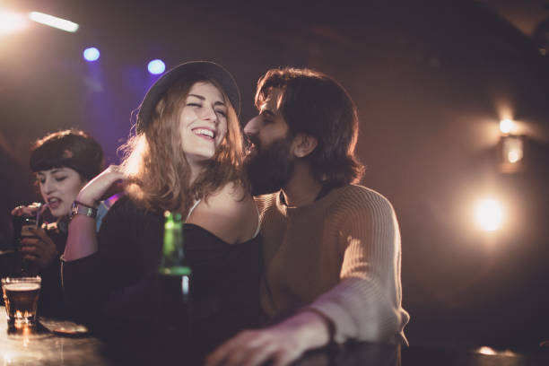 istock Couple flirting in the club 677079828