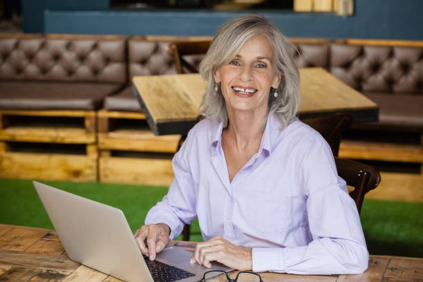 istock Portrait of senior woman using laptop computer 677079930