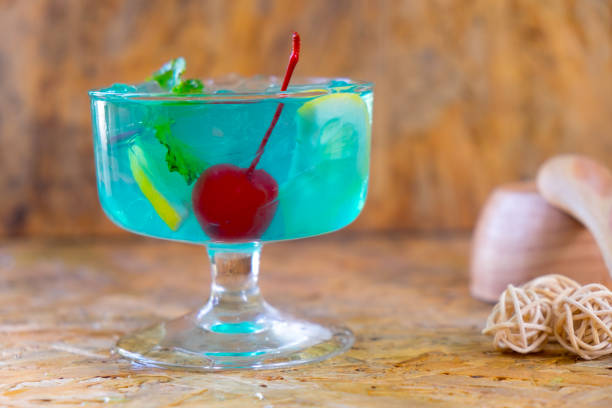 istock blue drinks with soda and ice in glass on wood table 677105302