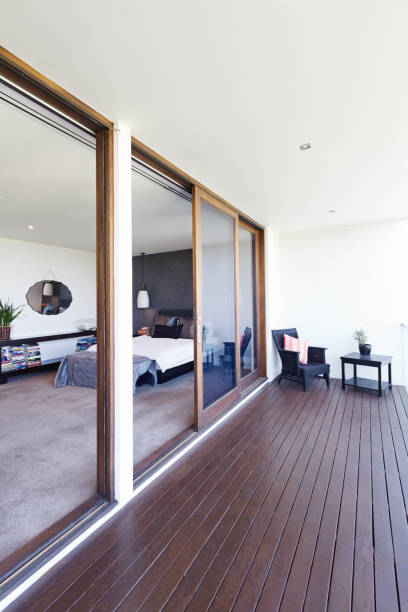 Master bedroom and large glass sliding doors to balcony