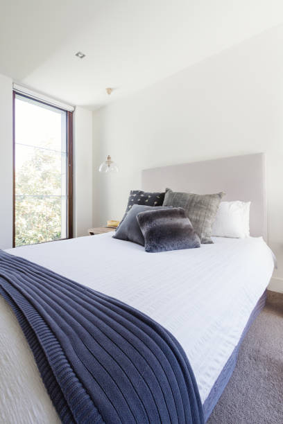 istock Navy grey and white color scheme in luxury bedroom interior 677107956