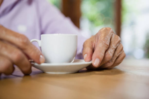 istock Midsection of woman holding coffee cup 677146380