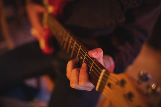 istock Mid-section of man playing guitar 677149420