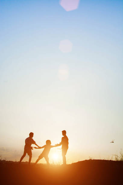 istock Children playing on summer sunset happy time 677159920