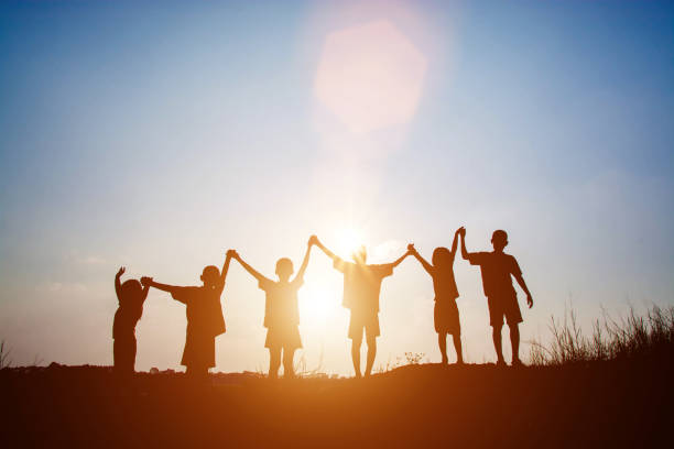 istock Silhouette Children playing on summer sunset happy time 677168120