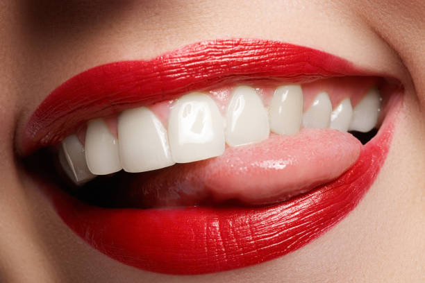 istock Close-up happy female smile with healthy white teeth, bright red lips make-up 677169744