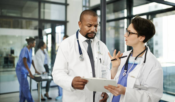istock Discussing their patient's recovery in detail 677175934