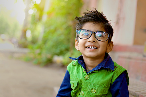 Indian child wear eyeglass