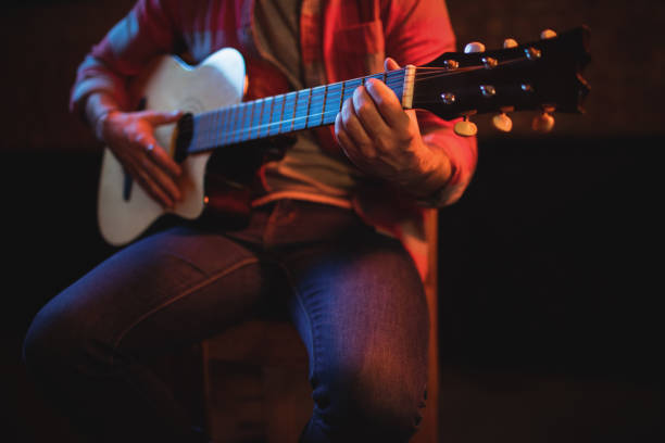 istock Mid-section of man playing guitar 677180380