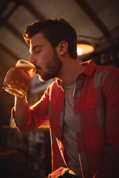 istock Young man having mug of beer 677182328
