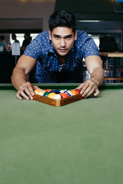 istock Young man setting up for a game of bialliards in an Australian pub 677193048