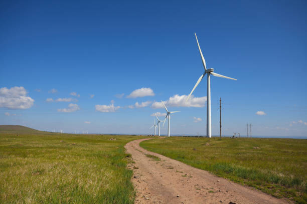 istock Empty road surface floor with Eco-environmentally friendly power generation of power turbines of green energy 677193578
