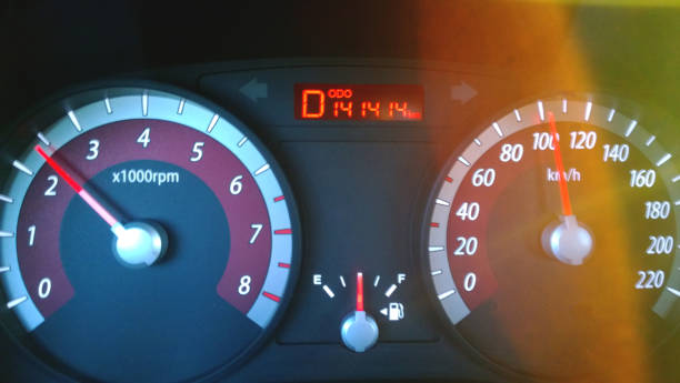istock Car dashboard while driving at high speed - a nice number on the odometer, the bright glare of the sun. Blurry 677218350