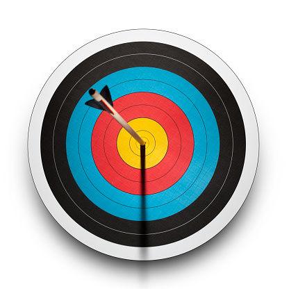 Arrow in the bullseye of an archery target on a white background.