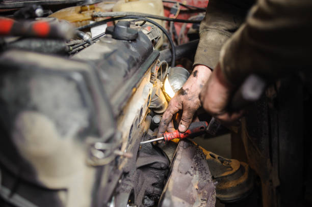 istock Hands of repairman mechanic working on engine using tool 677239036