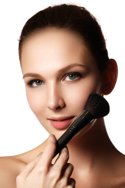 istock Beauty model with makeup brush. Bright make-up for brunette woma 677239846
