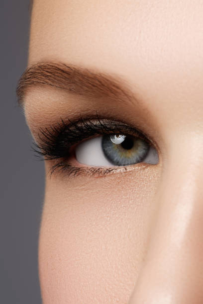istock Macro shot of woman's beautiful eye with extremely long eyelashe 677240316