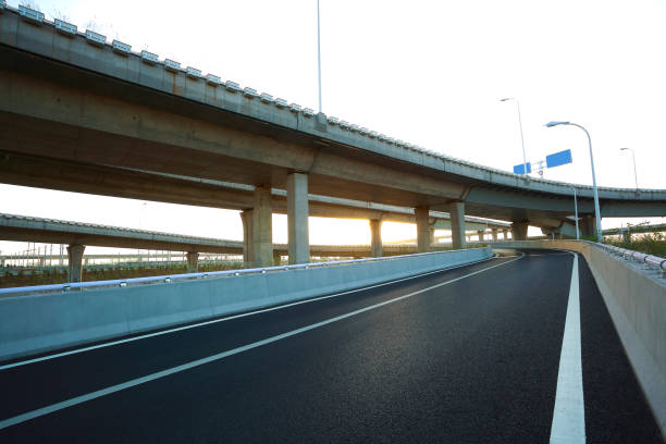 istock Empty road floor with city overpass viaduct bridge 677249814