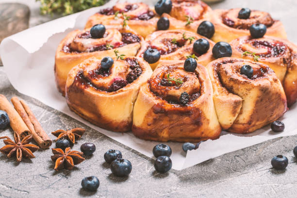 istock Cinnamon buns with lemon, blueberry and thyme 677252546