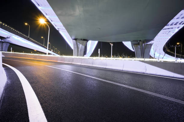 istock Empty road floor with city overpass viaduct bridge 677254100