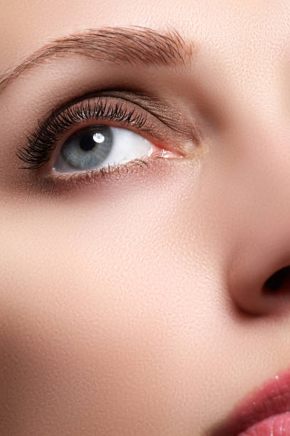 istock Macro shot of woman's beautiful eye with long eyelashes 677264402