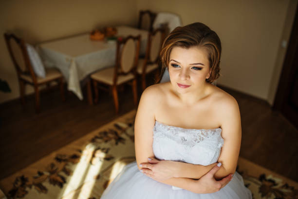 istock Young bride posed at her room in morning wedding. 677274052