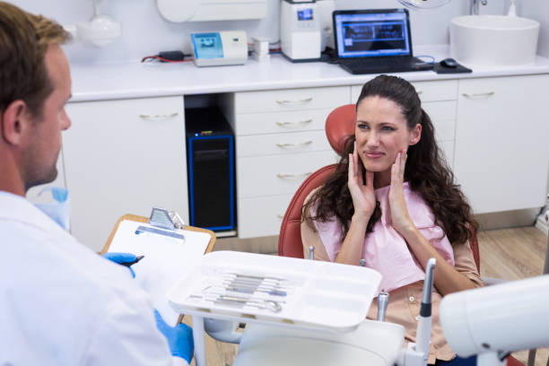 istock Dentist talking to female patient 677302066