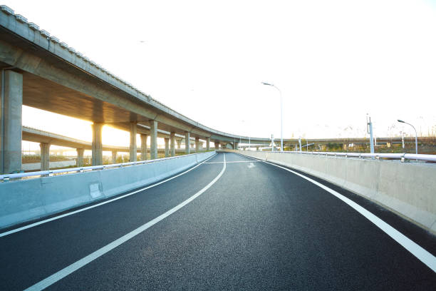 istock Empty road floor with city overpass viaduct bridge 677327804