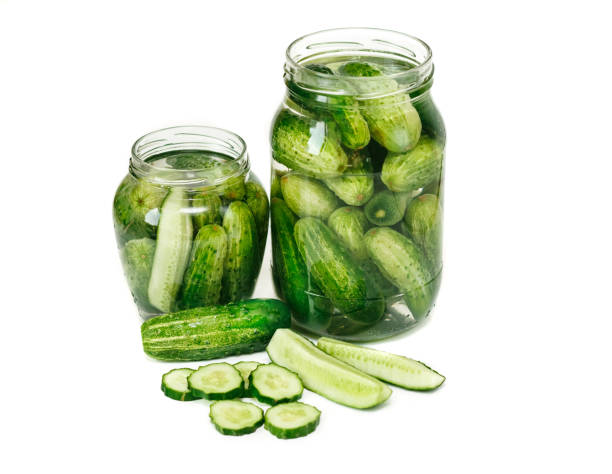 istock Preserved cucumbers in jars.White background 677352316