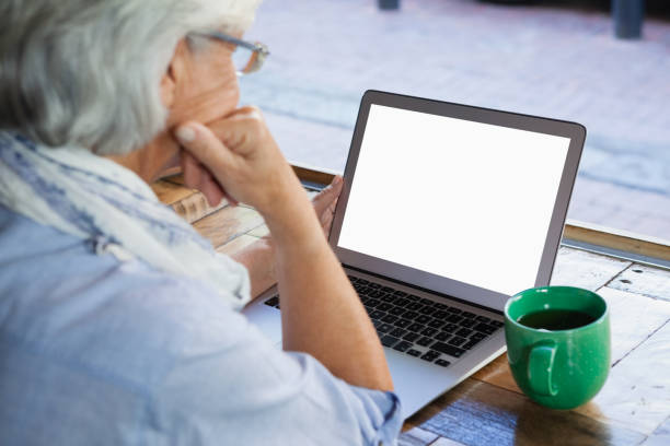 istock High angle view of thoughtful senior woman using laptop 677363638