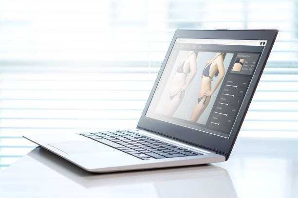 istock Image manipulation software in a laptop in office. Transforming girl skinnier and slim for marketing or advertisement. Photo editing and beauty standards concept. 677376782