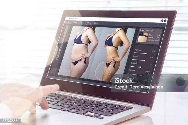 Professional Man Using Laptop To Transform Chubby Woman Slim Heavy Photo Editing With Computer Software Standard Of Beauty Body Image And Post Production Concept Stock Photo - Download Image Now