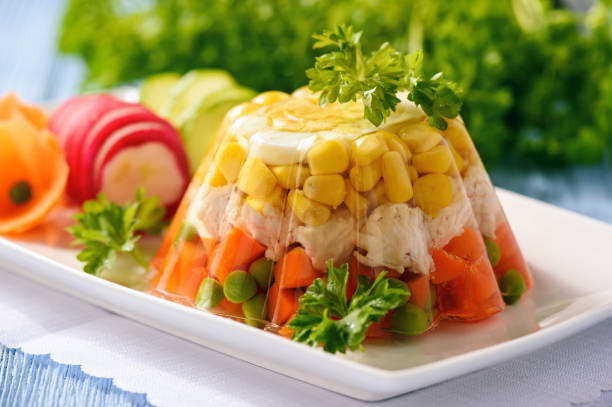 Aspic- jellied chicken with egg and vegetables. Aspic- jellied chicken with egg and vegetables. aspic stock pictures, royalty-free photos & images