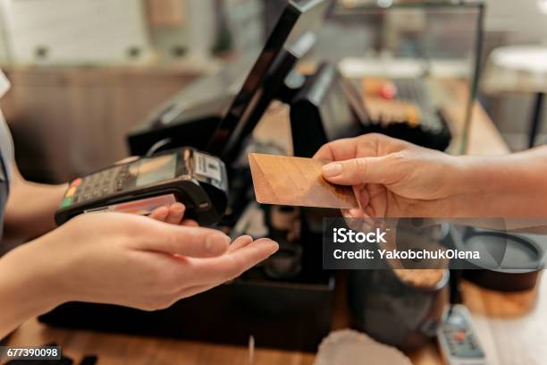Customer Buying Food In Shop Stock Photo - Download Image Now - Paying, Playing Card, Greeting Card