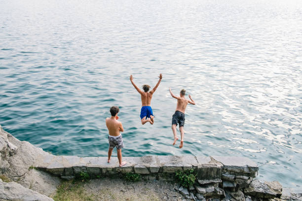 istock Two man diving in the water 677393316