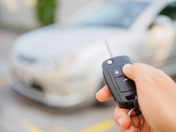 istock hand presses on the remote control car alarm systems 677406946