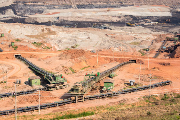 istock Part of a coal mine pit with big mining truck working 677427546