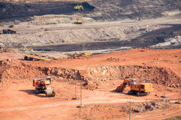 istock Part of a coal mine pit with big mining truck working 677427574