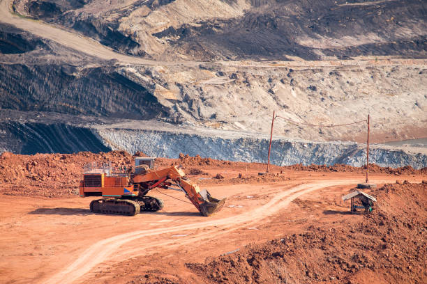 istock Part of a coal mine pit with big mining truck working 677427620