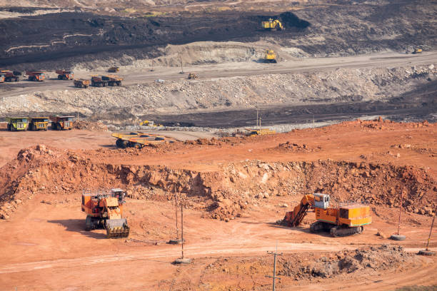 istock Part of a coal mine pit with big mining truck working 677427624
